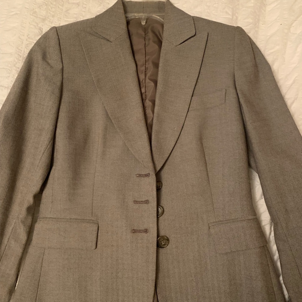 Tan pant suit. In excellent condition, fits nicely.
